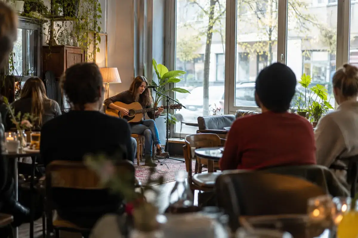 AI-generated illustration Acoustic guitarist playing to a small audience in a cafe — AI-generated illustration