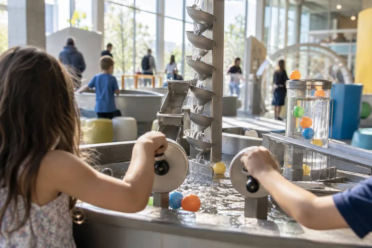 AI-generated illustration Child at a hands-on water play exhibit in a science centre — AI-generated illustration